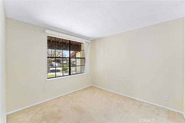 empty room featuring light colored carpet