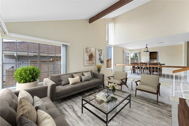 living room featuring high vaulted ceiling and beam ceiling