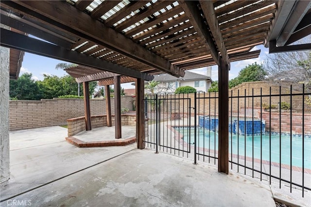 view of patio / terrace featuring a fenced in pool and a pergola