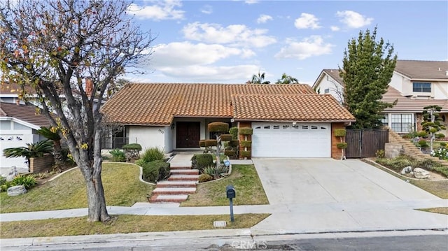 view of front of home featuring a garage and a front lawn