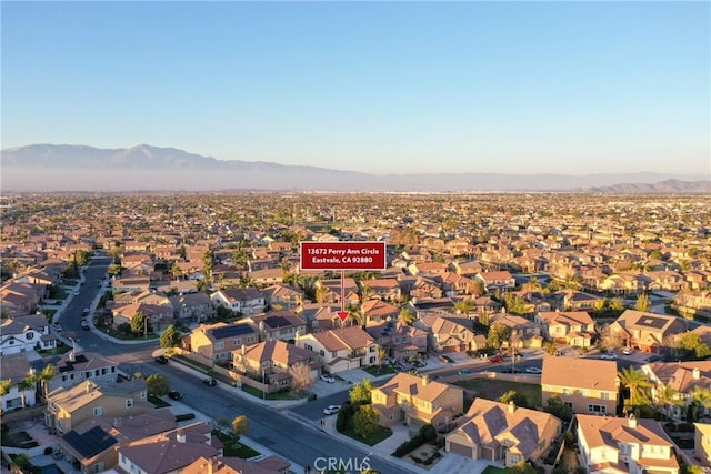 birds eye view of property with a residential view and a mountain view