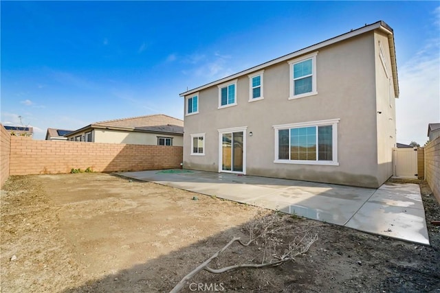 back of property featuring a patio