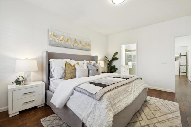 bedroom with dark hardwood / wood-style floors and ensuite bath