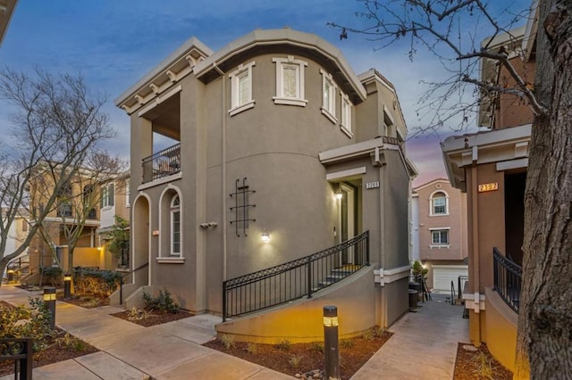 outdoor building at dusk featuring a garage