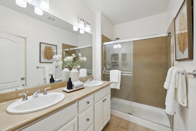 bathroom with vanity, tile patterned floors, and walk in shower