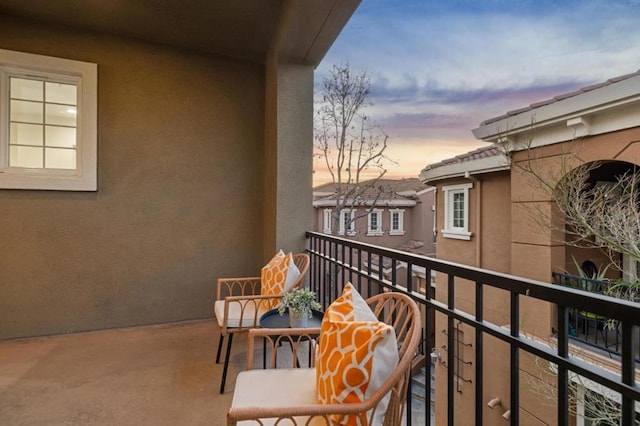 view of balcony at dusk