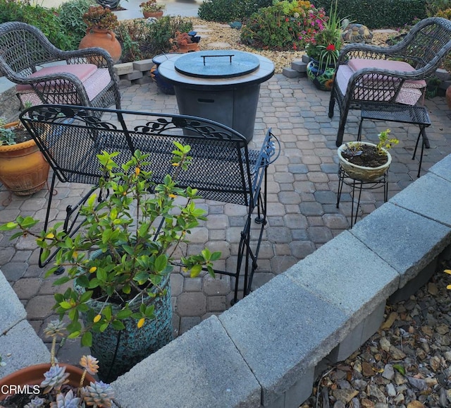 view of patio with a fire pit