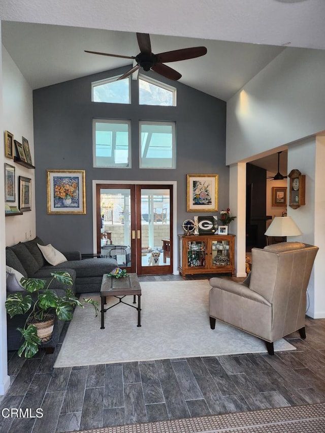 living room with ceiling fan and high vaulted ceiling