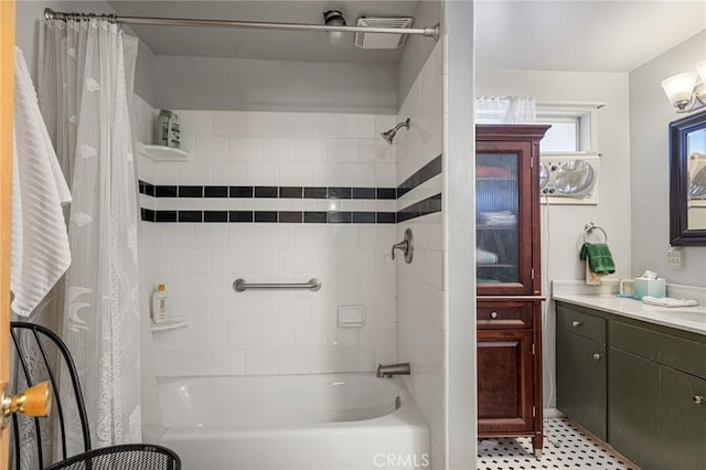 bathroom featuring vanity and shower / bath combination with curtain