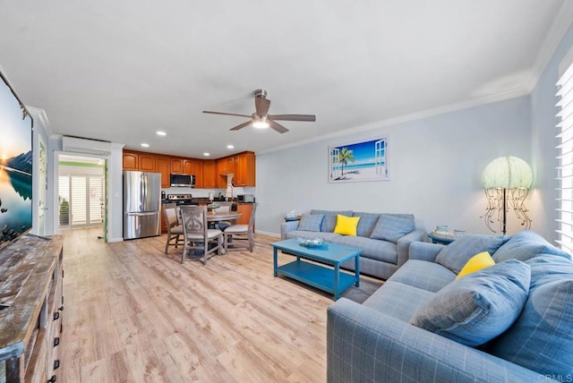 living room featuring a wall mounted air conditioner, crown molding, ceiling fan, and light wood-type flooring