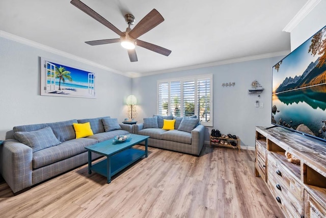 living room featuring crown molding, ceiling fan, and light hardwood / wood-style floors