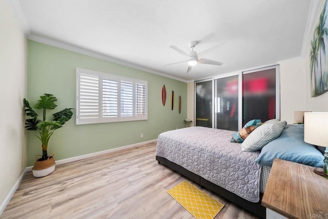 bedroom featuring crown molding, light hardwood / wood-style floors, and ceiling fan