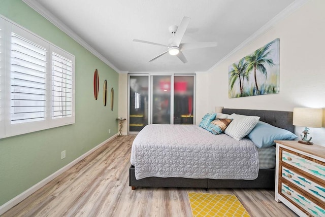 bedroom with crown molding, light hardwood / wood-style floors, and ceiling fan