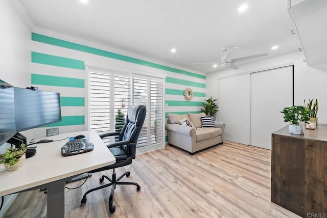 home office featuring light hardwood / wood-style flooring and ceiling fan