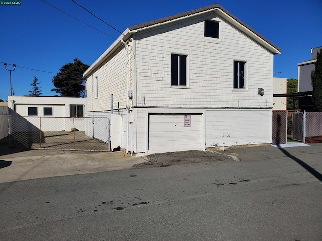 view of side of property with a garage