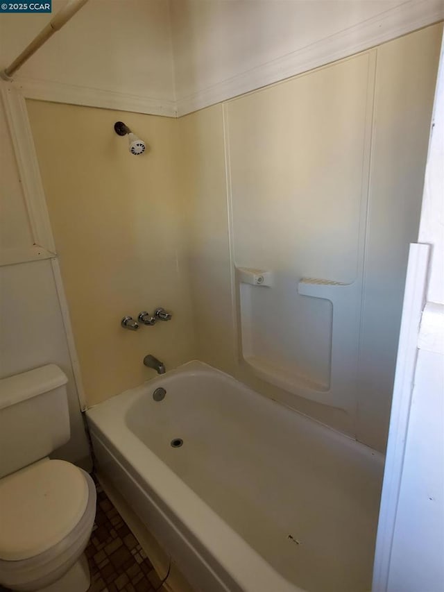 bathroom featuring toilet and tub / shower combination