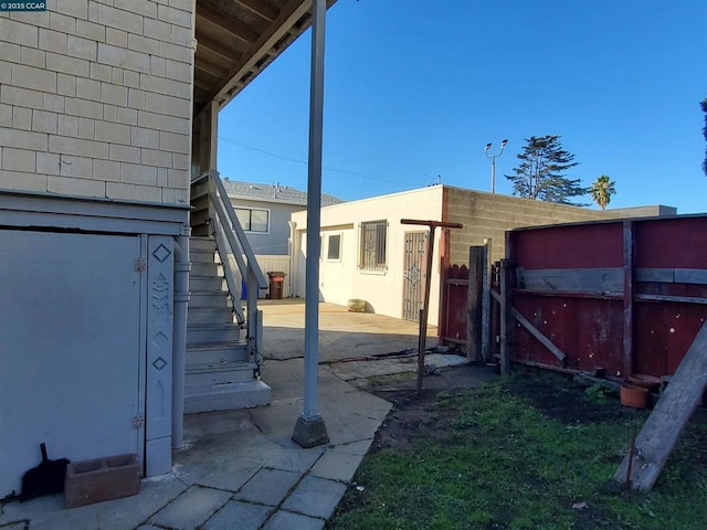 exterior space featuring a jacuzzi and a patio area