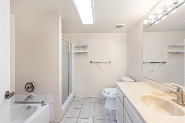 full bathroom featuring toilet, tile patterned flooring, a shower stall, and vanity