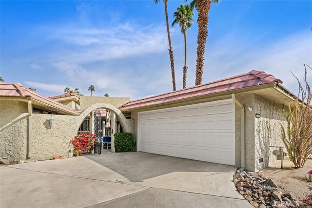 view of front of property with a garage