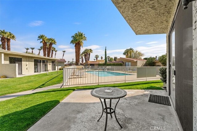 view of patio / terrace featuring a fenced in pool