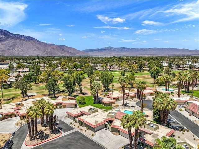 birds eye view of property with a mountain view