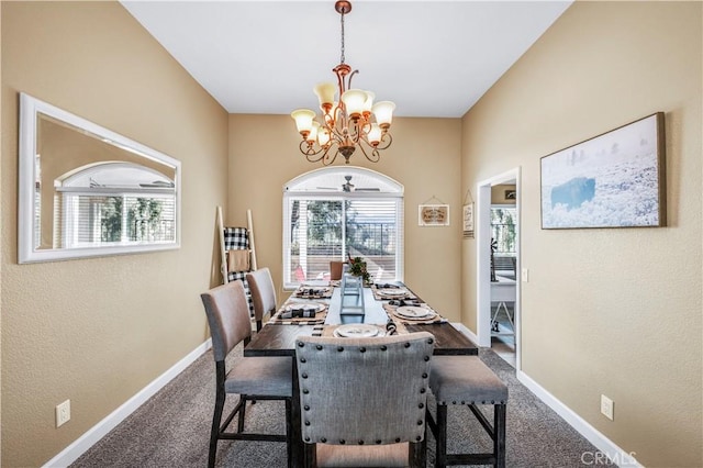 carpeted dining area with an inviting chandelier