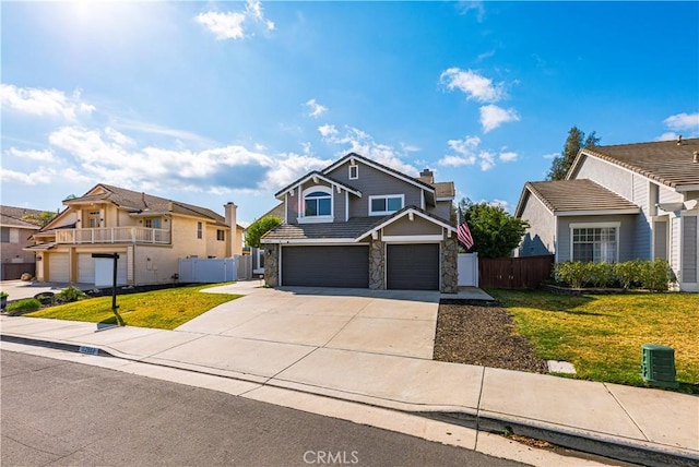 view of front of home with a garage and a front yard