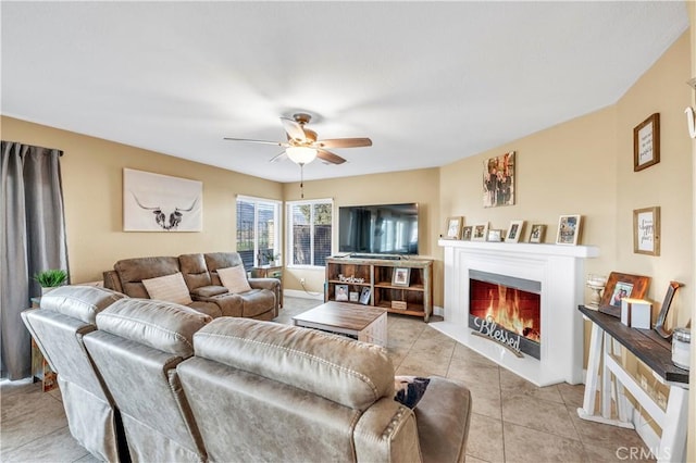 tiled living room featuring ceiling fan