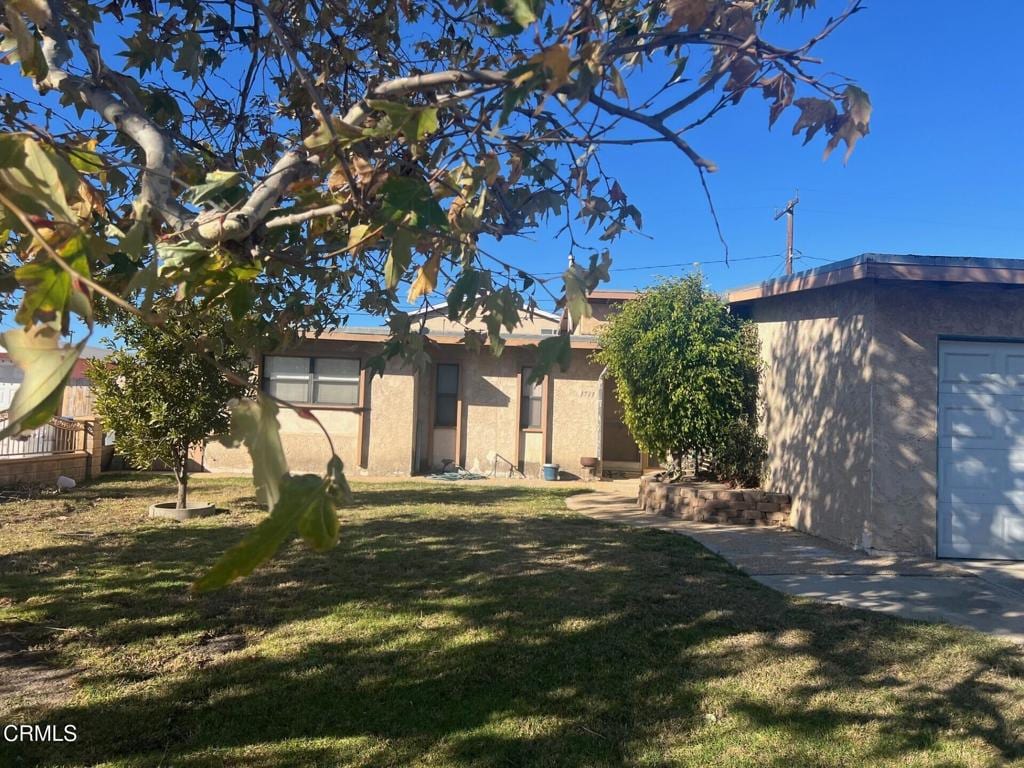 exterior space with a front yard