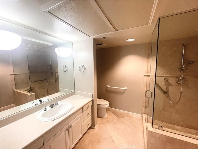 bathroom with vanity, toilet, tile patterned floors, and walk in shower