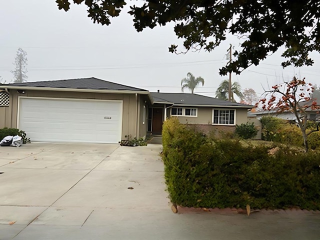 ranch-style home with a garage