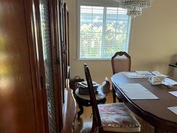 dining space featuring a notable chandelier