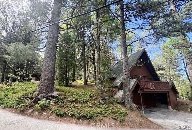 view of side of property featuring a deck