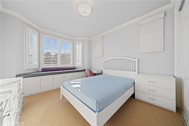 carpeted bedroom featuring ornamental molding