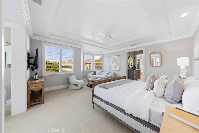 carpeted bedroom with crown molding, ceiling fan, and a tray ceiling