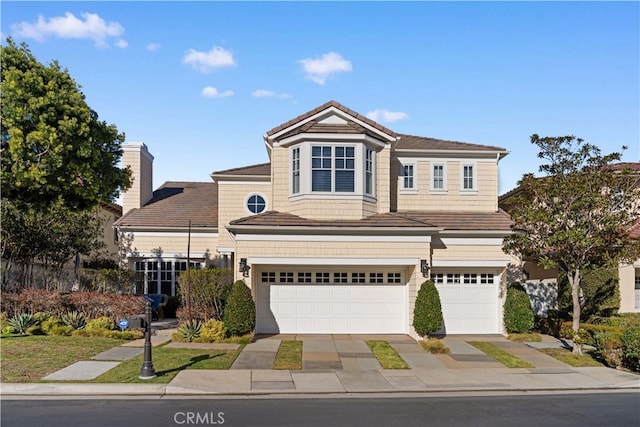 front of property with a garage