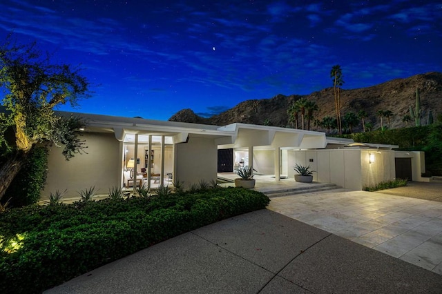 view of front of home featuring a mountain view