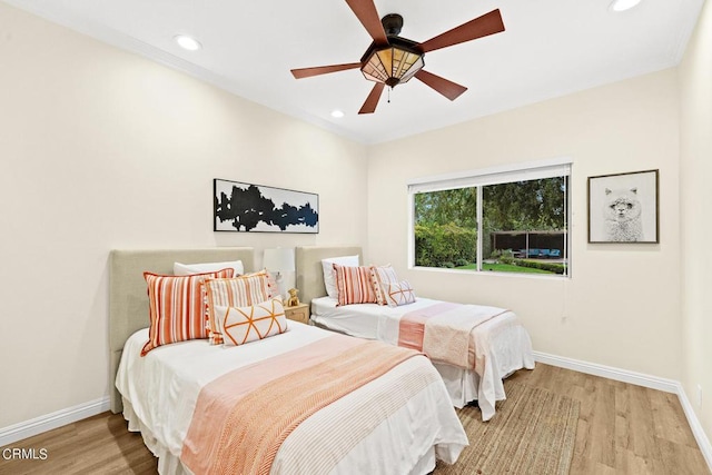 bedroom featuring ceiling fan and light wood-type flooring