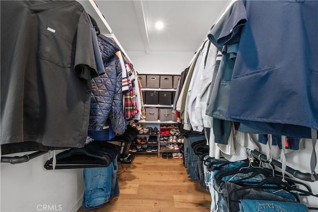 walk in closet featuring light hardwood / wood-style flooring