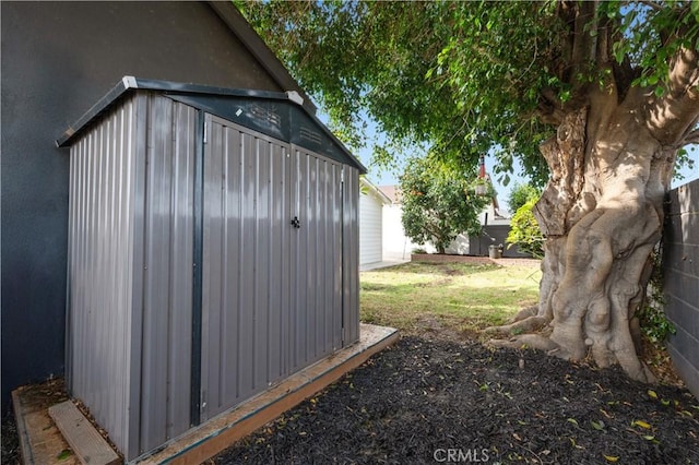 view of outbuilding featuring a lawn