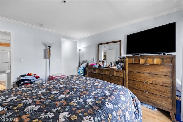 bedroom featuring hardwood / wood-style floors and ornamental molding