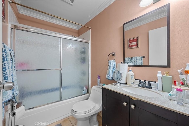 full bathroom featuring shower / bath combination with glass door, tile patterned flooring, vanity, toilet, and crown molding