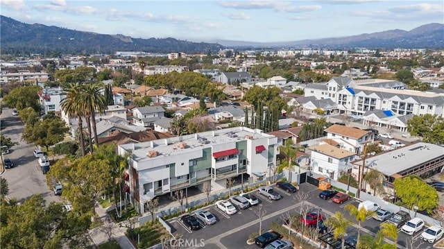 birds eye view of property with a mountain view