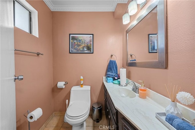 bathroom featuring vanity, tile patterned flooring, crown molding, and toilet