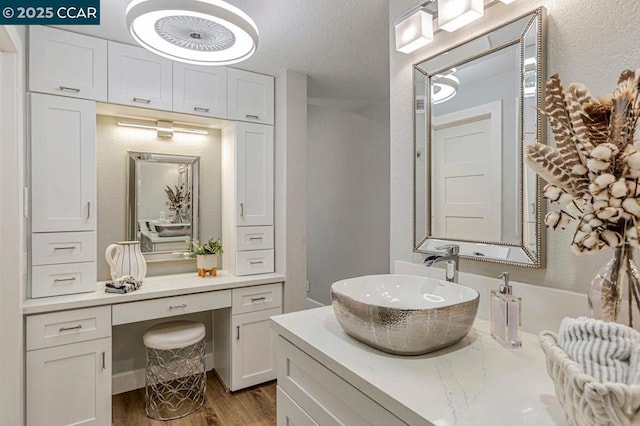 bathroom with vanity and wood-type flooring