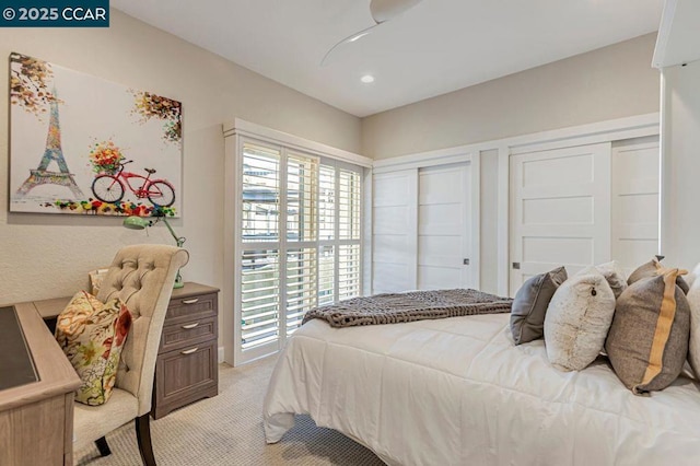 bedroom featuring light carpet