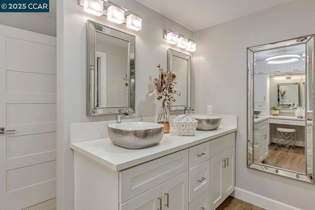 bathroom featuring vanity and wood-type flooring