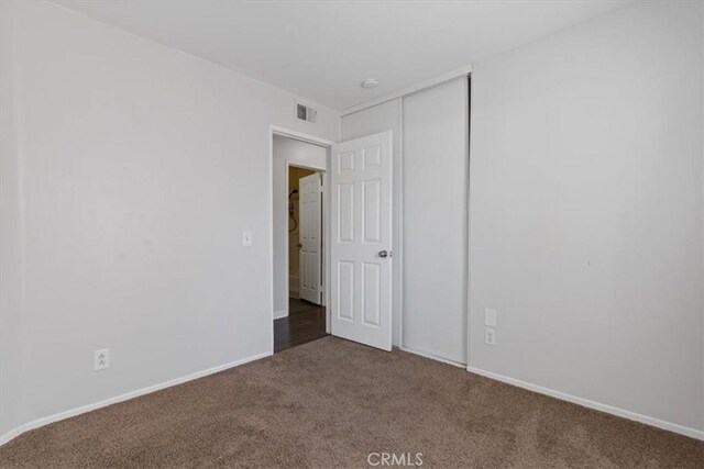 empty room with carpet flooring