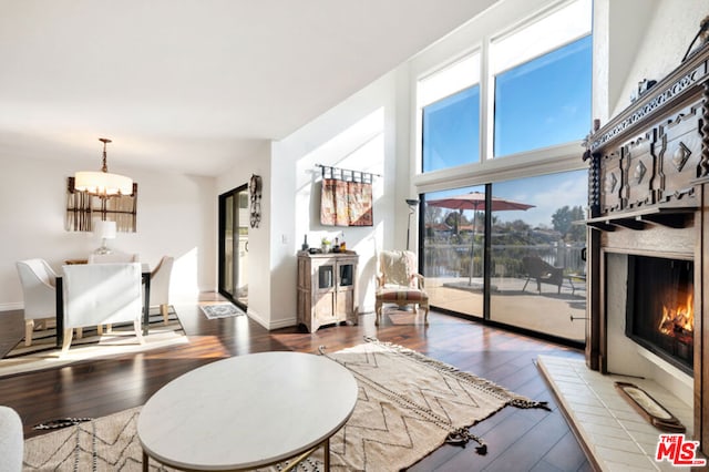 living room featuring a notable chandelier and hardwood / wood-style flooring