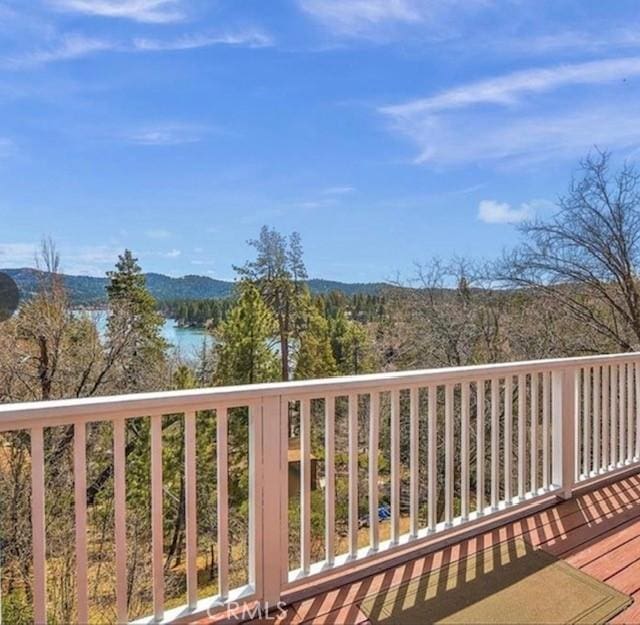 wooden deck with a mountain view